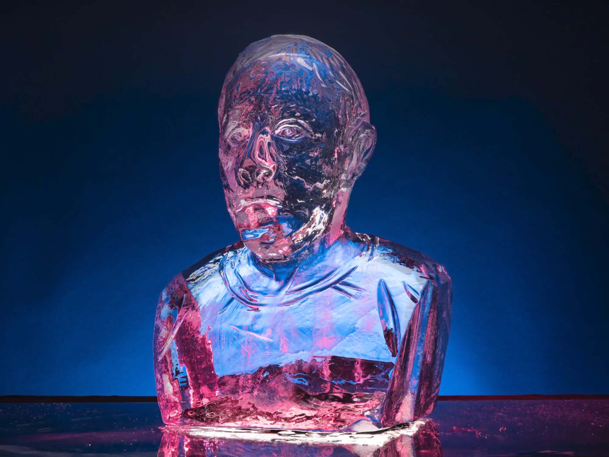 An ice sculpture bust of Mark Zuckerberg melting